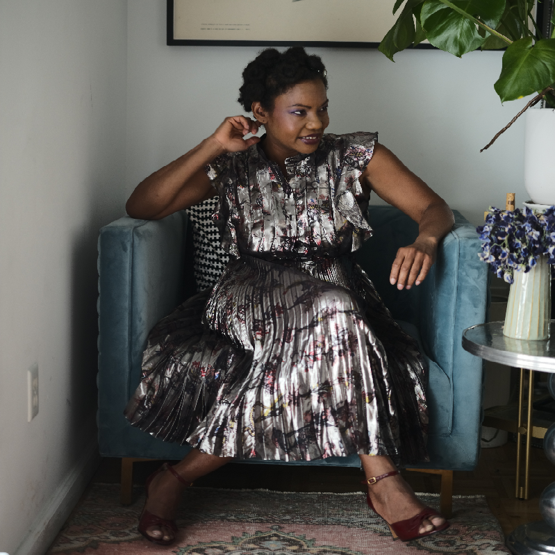 photo of maryam sitting on a chair